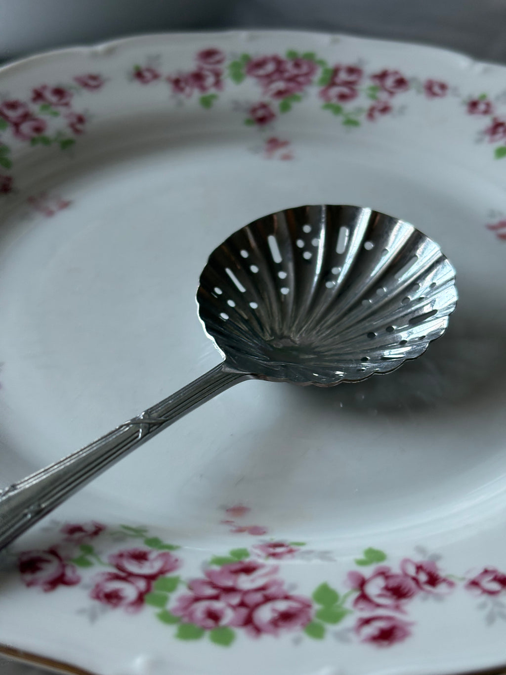 Schelpvormige poedersuiker lepel