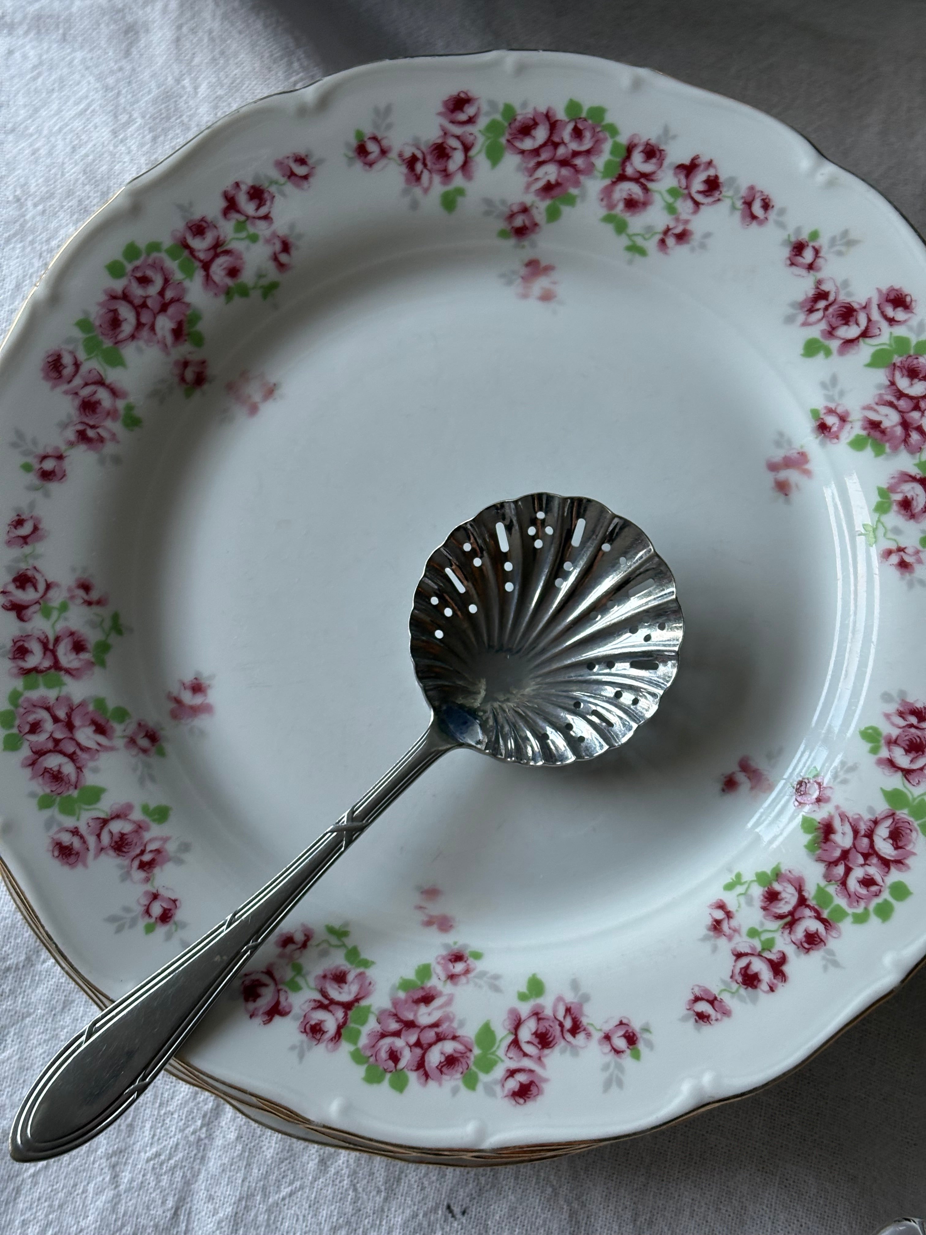 Schelpvormige poedersuiker lepel